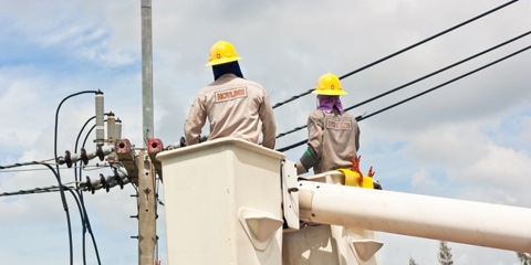 Electricians working on wire