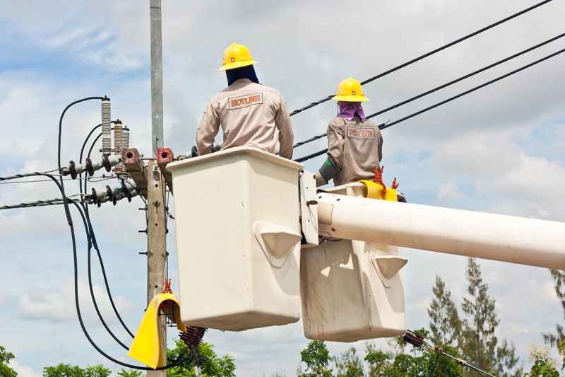 Electricians working on wire